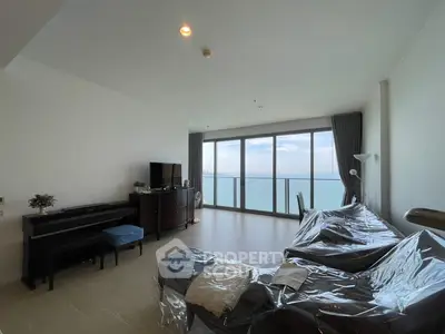 Spacious living room with stunning ocean view and modern furnishings