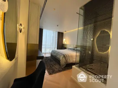 Luxurious bedroom with modern design, featuring elegant lighting, plush carpeting, and a sophisticated glass partition.