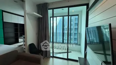 Modern apartment interior with large windows and balcony view