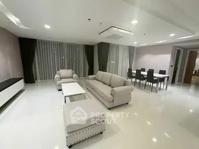 Spacious modern living room with elegant furniture and dining area