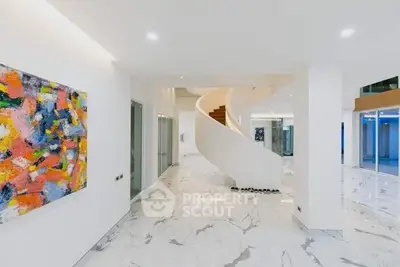 Luxurious modern interior with elegant spiral staircase and marble flooring