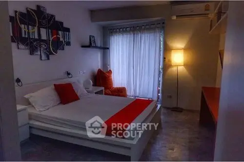 Cozy bedroom with modern decor and ambient lighting, featuring a comfortable bed and stylish wall art.