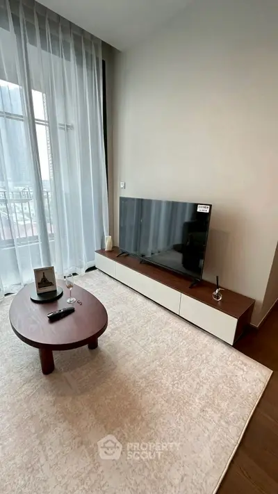 Modern living room with sleek TV setup and elegant coffee table