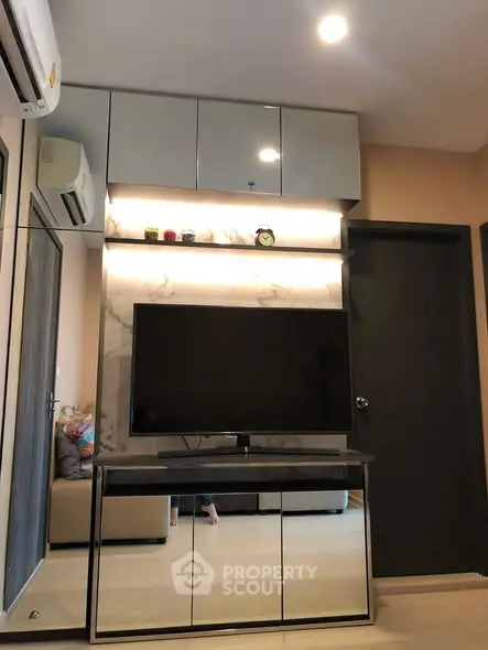 Modern living room with sleek TV unit and ambient lighting