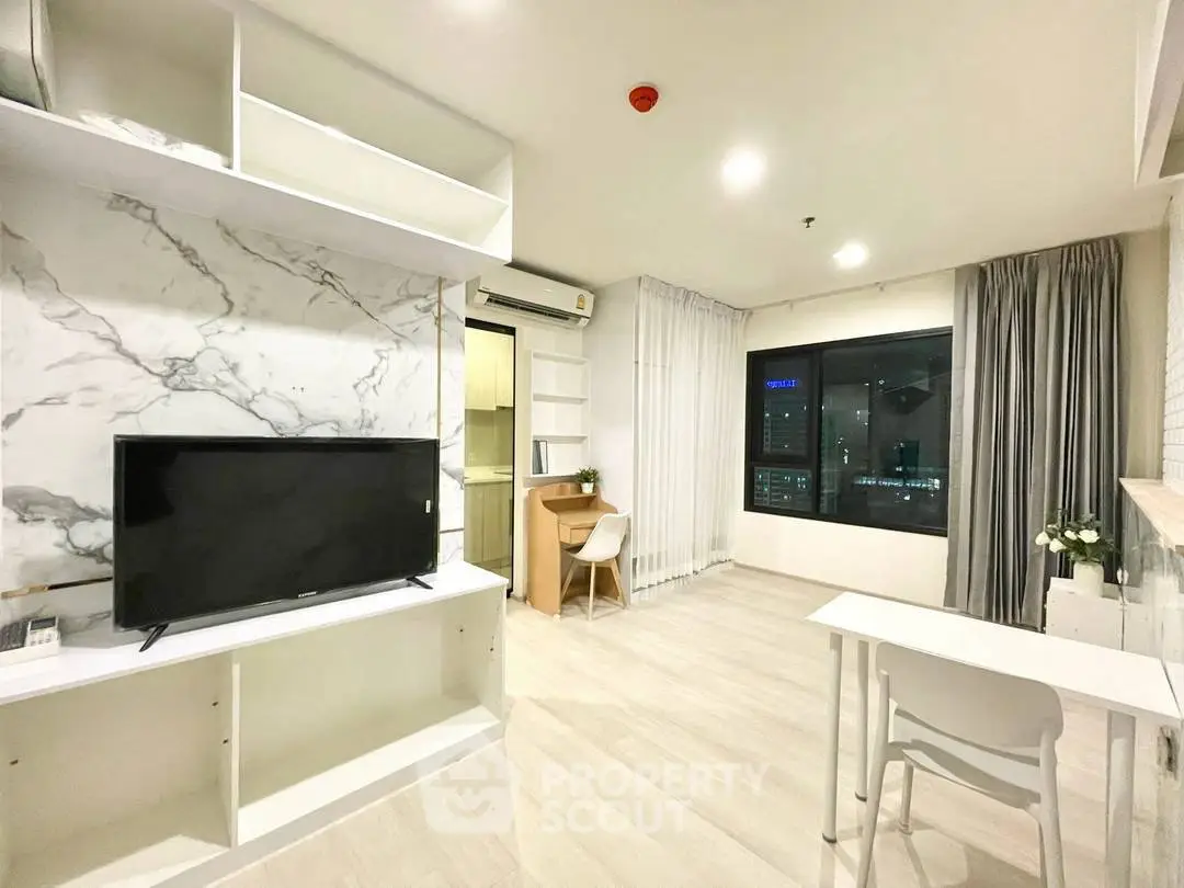 Modern living room with marble accent wall and city view, featuring sleek furniture and bright lighting.