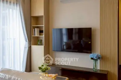 Modern living room with wall-mounted TV and elegant decor