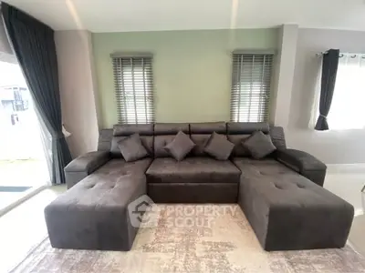 Spacious living room with modern sectional sofa and elegant decor