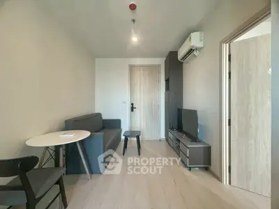 Modern living room with minimalist furniture and air conditioning