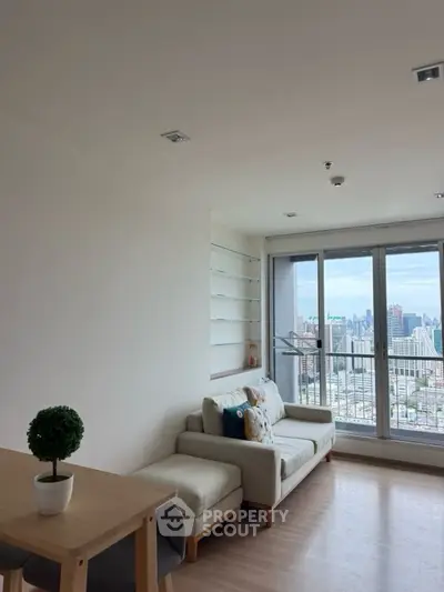 Modern living room with city view and cozy seating area