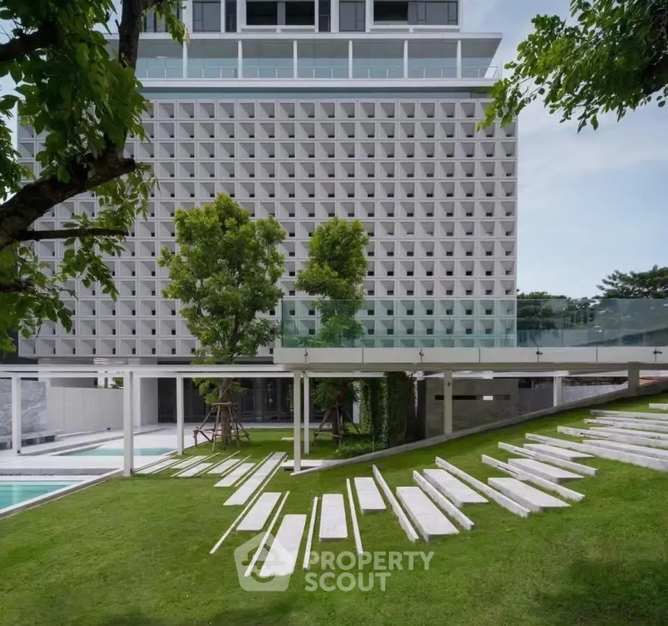 Modern building with unique facade and landscaped garden area