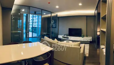 Modern living room with sleek design and large windows offering a stunning view.