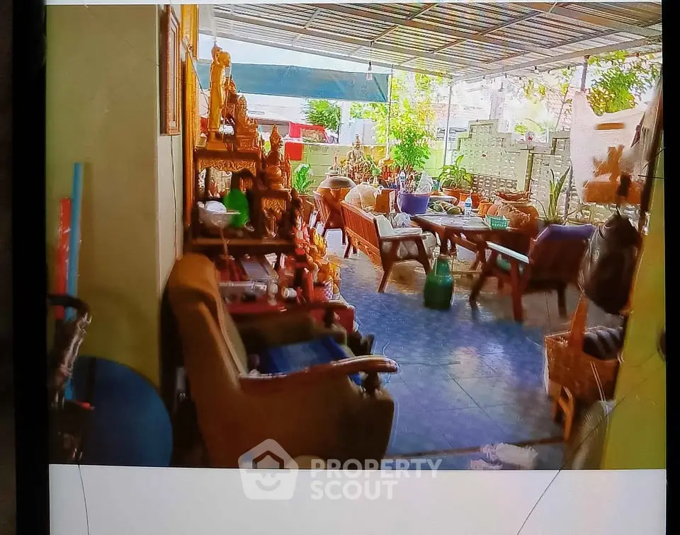 Charming outdoor patio with cozy seating and vibrant decor, perfect for relaxation and entertaining guests.