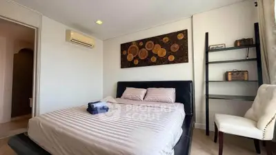 Cozy bedroom with modern decor and air conditioning in a stylish apartment.