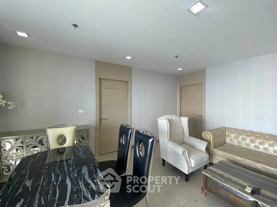 Luxurious living room with elegant furniture and marble dining table