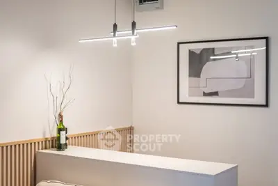 Modern minimalist interior with sleek lighting and abstract art