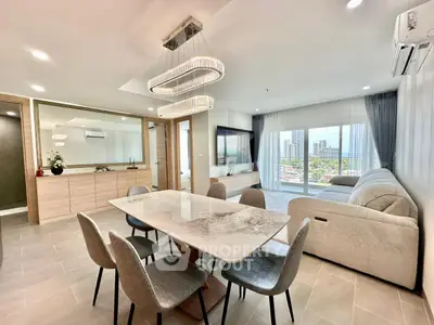 Spacious modern living room with elegant dining area and city view