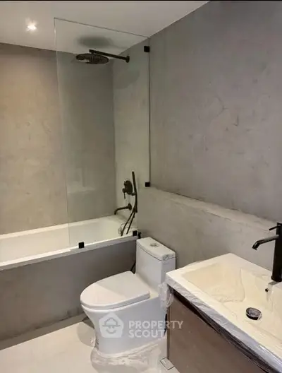 Modern bathroom with sleek design and glass shower partition