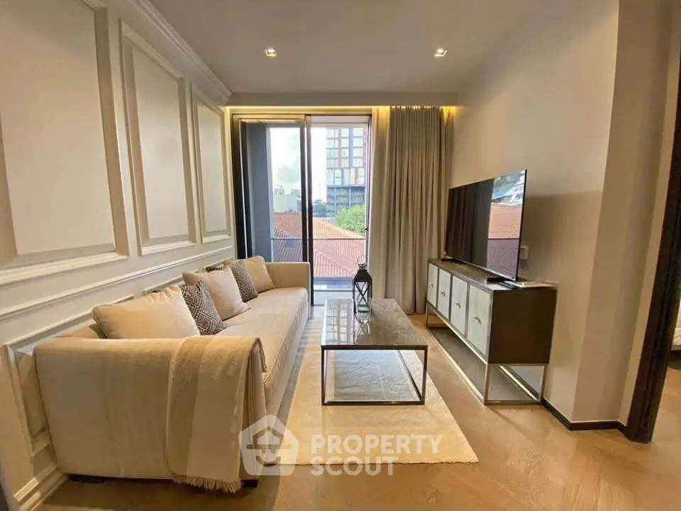 Elegant living room with modern decor, large window, and stylish furniture in a luxurious apartment.