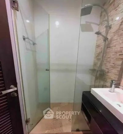 Modern bathroom with glass shower and sleek fixtures