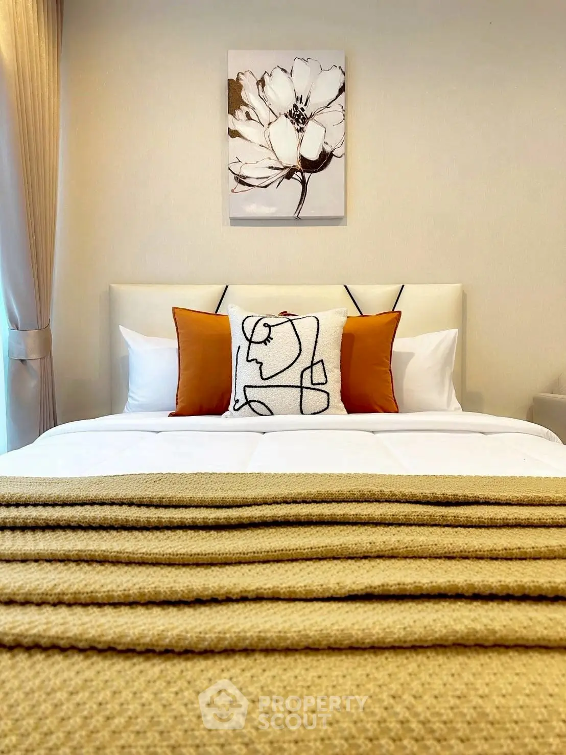 Elegant bedroom with stylish decor and cozy bedding, perfect for relaxation.