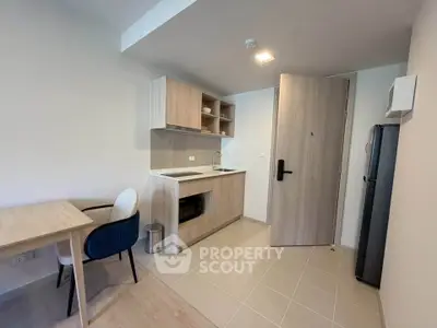 Modern kitchen with open layout and dining area in a stylish apartment
