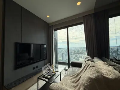 Modern living room with panoramic city view and sleek interior design.