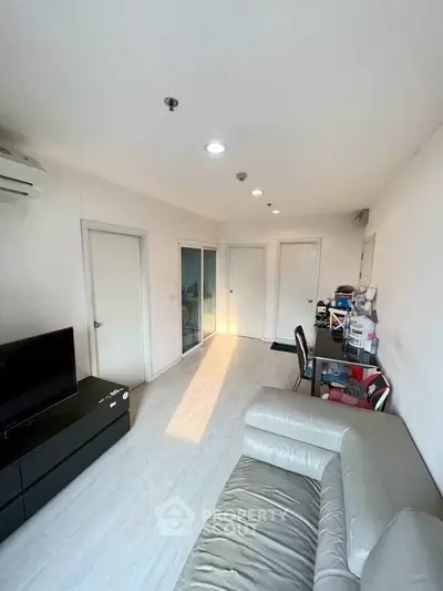 Bright and modern living room with sleek furniture and natural light