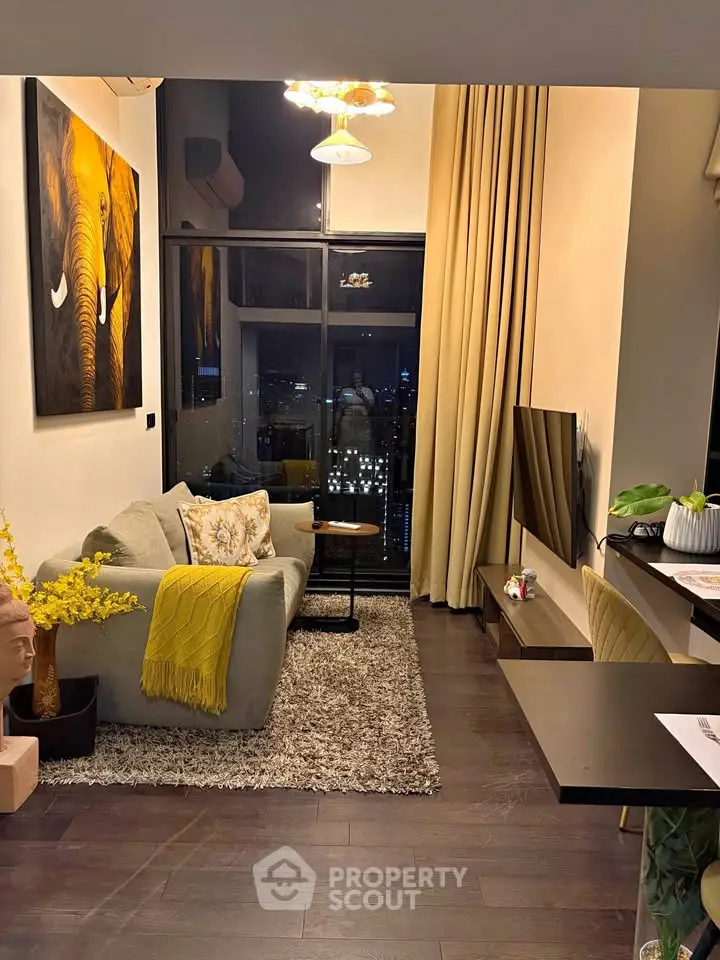 Stylish modern living room with city view, cozy sofa, and elegant decor
