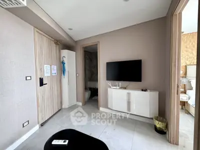 Modern living room with wall-mounted TV and stylish decor