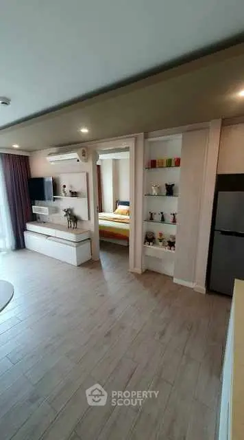 Modern open-plan living room with stylish decor and natural light