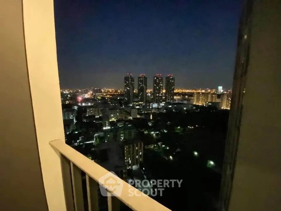 Stunning night cityscape view from high-rise balcony, perfect for urban living enthusiasts.