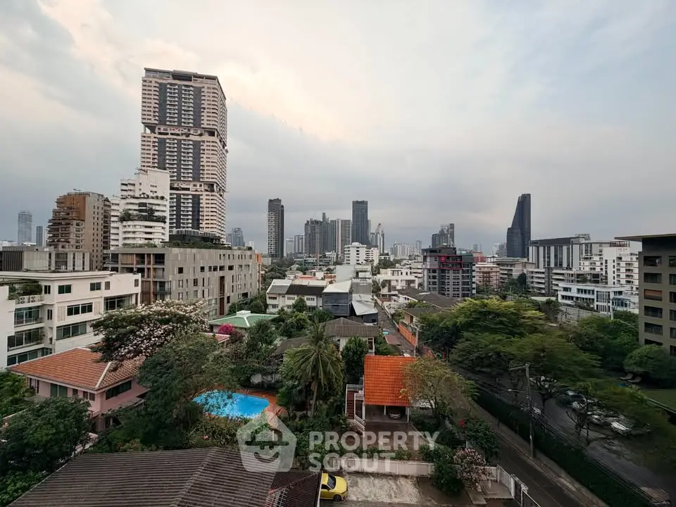 Stunning cityscape view with high-rise buildings and lush greenery, perfect for urban living enthusiasts.