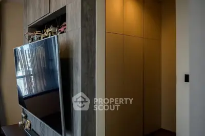 Modern living room with sleek TV and stylish cabinetry