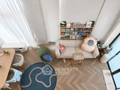 Stylish modern living room with unique decor and open layout, featuring cozy seating and natural light.
