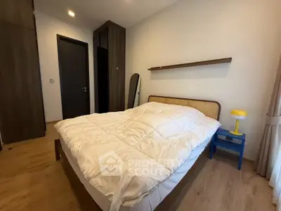 Cozy bedroom with modern wooden flooring and stylish decor