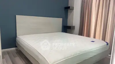 Modern bedroom with stylish bed and elegant curtains in a cozy apartment.
