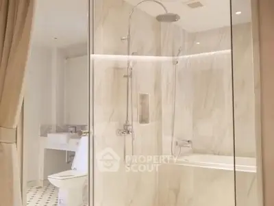 Luxurious bathroom with elegant marble shower and modern fixtures