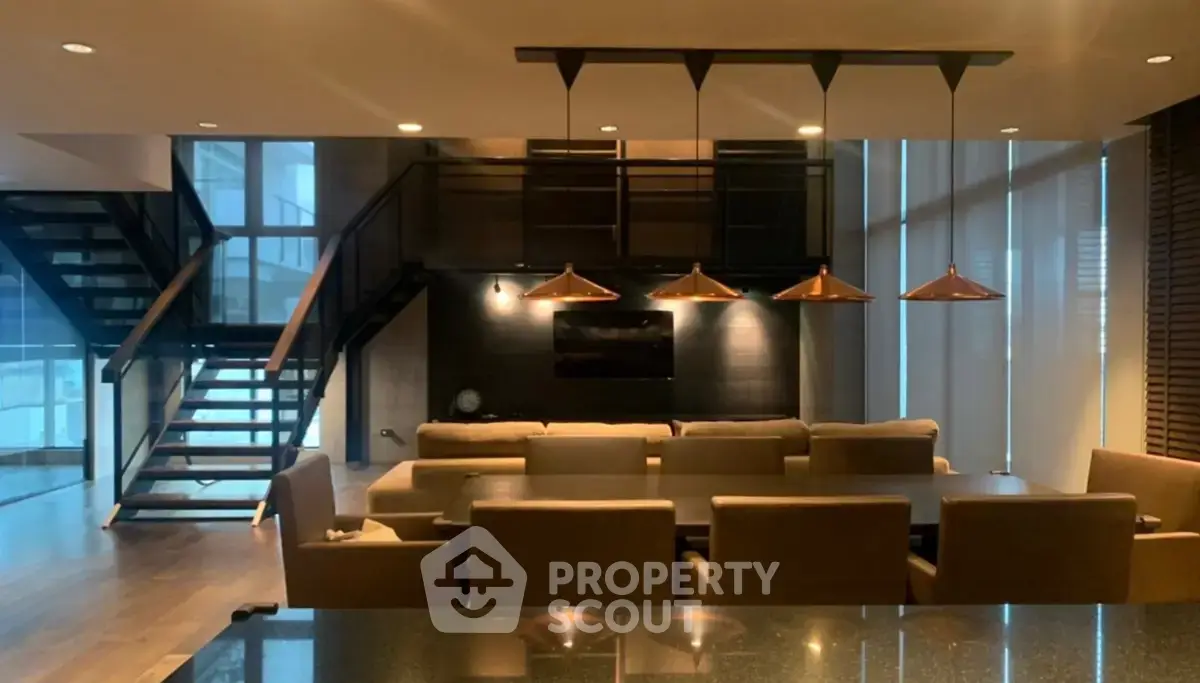 Luxurious modern living room with elegant lighting and stylish staircase