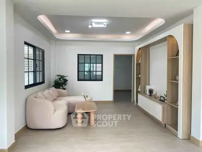 Modern living room with stylish furniture and built-in shelving, perfect for contemporary living.