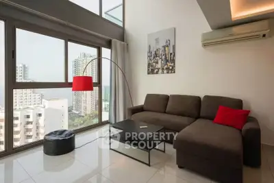 Modern living room with city view, featuring a stylish sofa and floor lamp.
