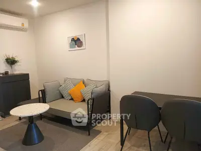Modern living room with stylish furniture and minimalist decor in a cozy apartment.