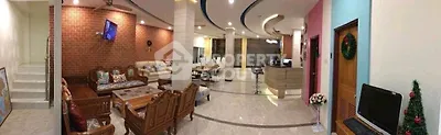 Spacious living room with elegant decor and modern amenities in a luxurious home.
