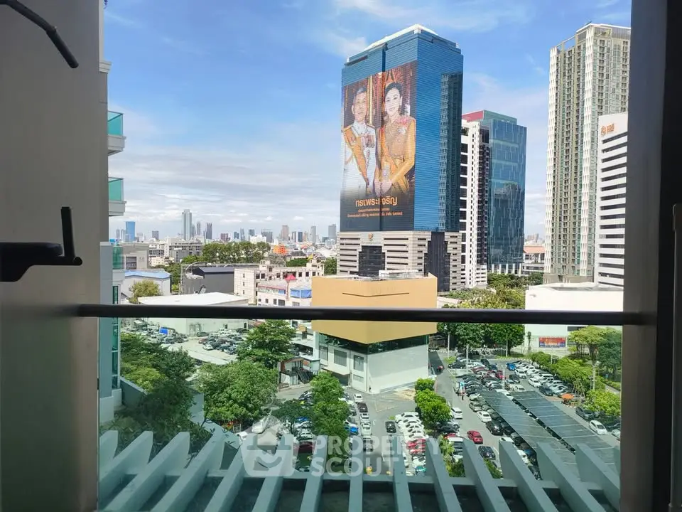 Stunning city view from a modern balcony in a high-rise building, perfect for urban living.