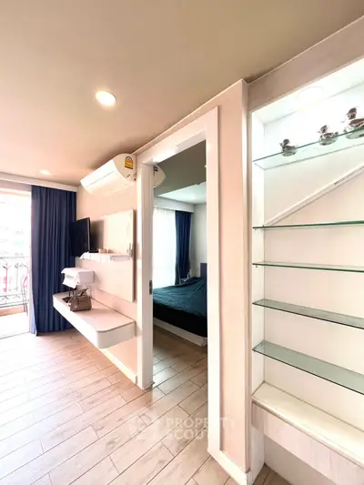 Modern apartment interior with open layout and balcony view