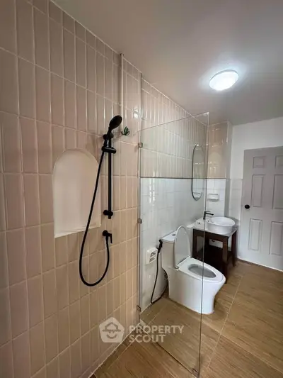 Modern bathroom with glass shower and sleek fixtures