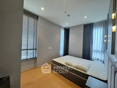 Modern bedroom with large windows and stylish decor