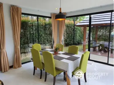 Elegant dining room with garden view and modern decor