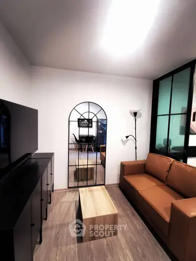 Modern living room with stylish decor and leather sofa