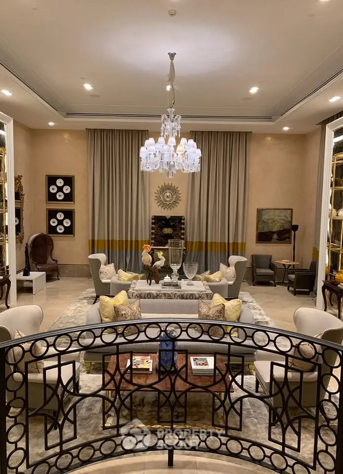 Luxurious living room with elegant chandelier and plush seating