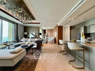 Luxurious open-plan living room with modern kitchen and elegant decor